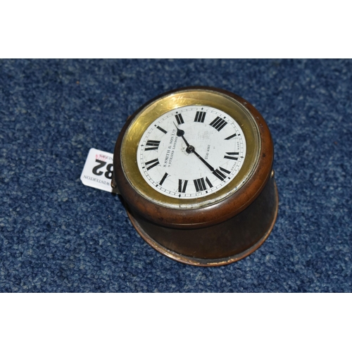 482 - A SMALL CLOCK SWISS MADE FOR S.SMITH & SON LTD. 8-day motor clock in brass case, stamped 370, with k... 