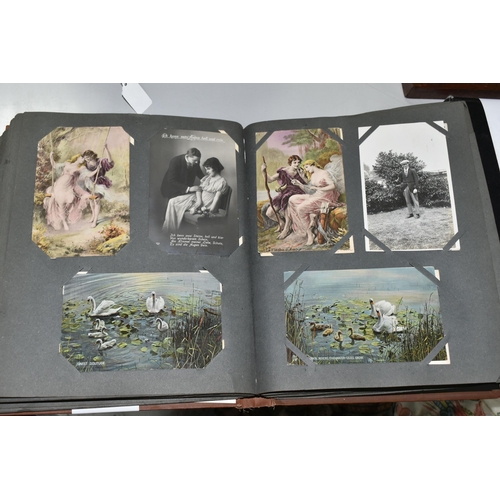 489 - TWO POSTCARD ALBUMS one album contains a miscellaneous collection of approximately 284 early-late 20... 