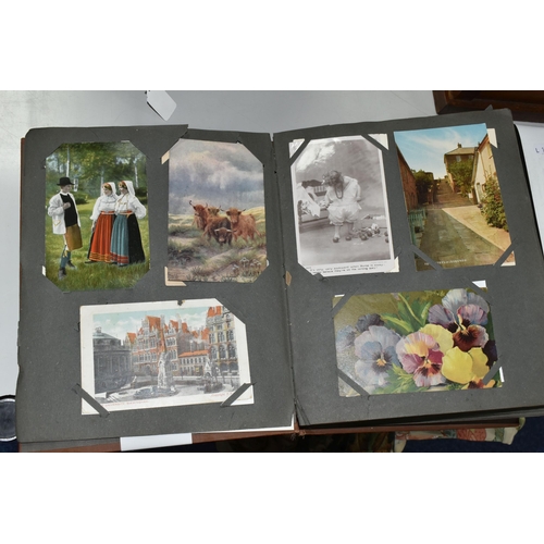 489 - TWO POSTCARD ALBUMS one album contains a miscellaneous collection of approximately 284 early-late 20... 