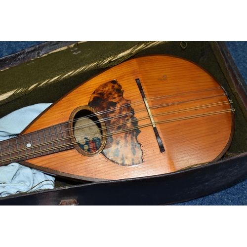 497 - A CASED EARLY 20TH CENTURY MARIO CASELLA MANDOLIN, eight strings, tortoiseshell sound hole, overall ... 