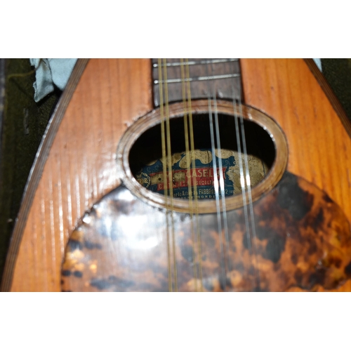 497 - A CASED EARLY 20TH CENTURY MARIO CASELLA MANDOLIN, eight strings, tortoiseshell sound hole, overall ... 