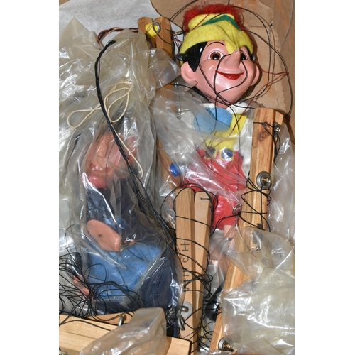 507 - A BOX CONTAINING A PELHAM PINOCCHIO PUPPET AND ELEVEN HOMEMADE PUPPETS, Pinocchio unboxed, the other... 