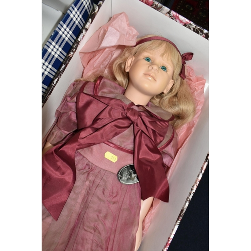 512 - A BOXED RUTH TREFFEISEN VINYL COLLECTORS DOLL, with swing tag, height approx. 75cm with a boxed Luna... 