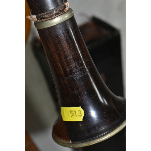 513 - A METZLER & CO OF LONDON WOODEN CLARINET, makers name stamped to the two lower sections, length 65cm... 