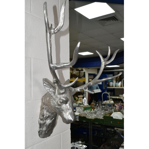 514 - FOUR PIECES OF STAG THEMED MODERN METALWARE, comprising two wall mounts, width of widest 56cm, a twi... 