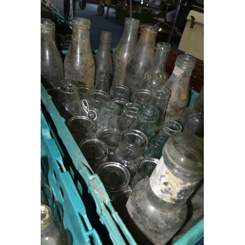 525 - FIVE CRATES OF VINTAGE GLASS BOTTLES AND STONEWARE, to include a collection of over one hundred bott... 