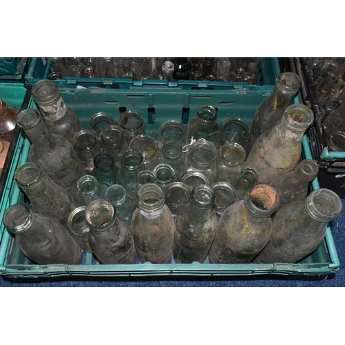 525 - FIVE CRATES OF VINTAGE GLASS BOTTLES AND STONEWARE, to include a collection of over one hundred bott... 