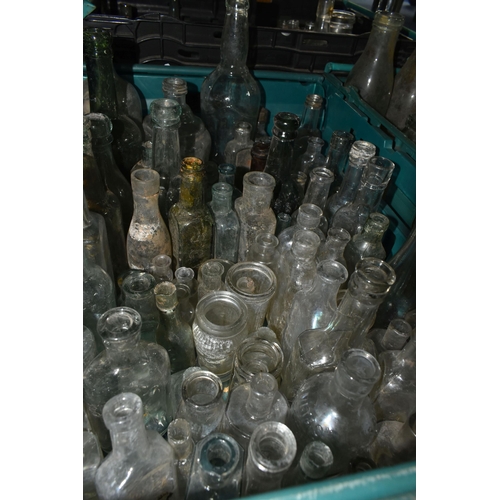 525 - FIVE CRATES OF VINTAGE GLASS BOTTLES AND STONEWARE, to include a collection of over one hundred bott... 