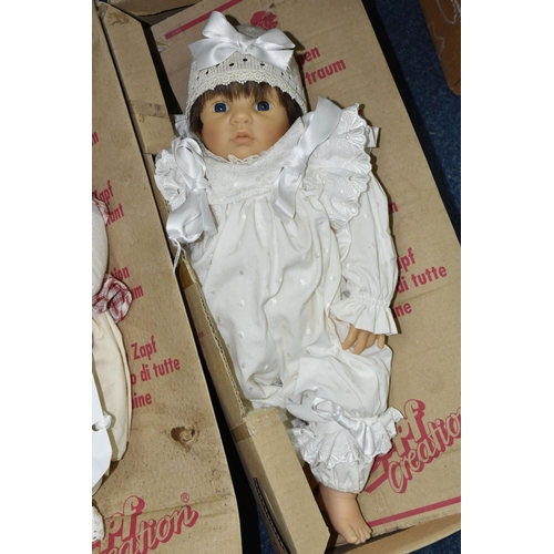 544 - FIVE BOXED ZAPF CREATION DESIGNER AND COLLECTION DOLLS, comprising 'Herzchen Bube' and 'Herzchen Mad... 