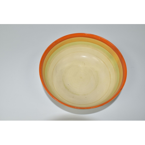 551 - A CLARICE CLIFF 'WINDBELLS' DESIGN BOWL, with a vibrant orange, yellow, green and cream banding on t... 