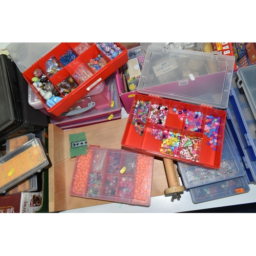 560 - TWO BOXES AND LOOSE GLASS AND PLASTIC BEADS AND BEADING LOOM, to include twelve plastic storage cont... 