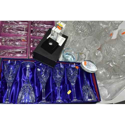 564 - A LARGE QUANTITY OF CUT CRYSTAL AND GLASSWARE, comprising a boxed Dartington Crystal contemporary de... 