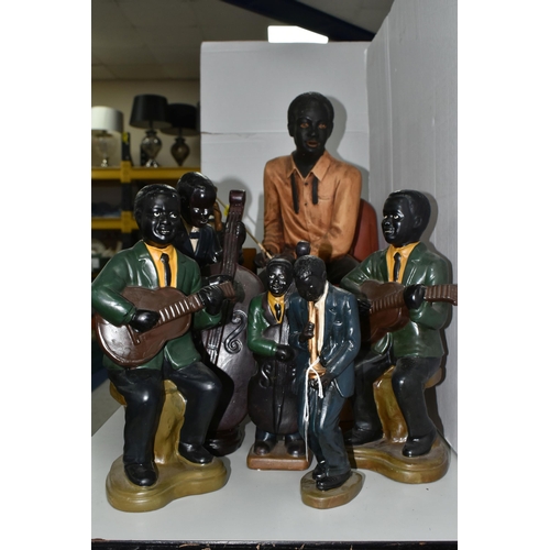 565 - A GROUP OF EIGHT CERAMIC JAZZ MUSICIANS, comprising bass player, trumpet player, two guitarists (one... 