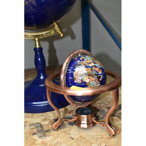 580 - TWO MODERN HARDSTONE EFFECT TERRESTRIAL GLOBES, one on a blue plinth, approx. height 65cm, the other... 