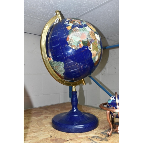 580 - TWO MODERN HARDSTONE EFFECT TERRESTRIAL GLOBES, one on a blue plinth, approx. height 65cm, the other... 