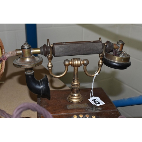 582 - AN EARLY 20TH CENTURY 'THE MAGNET' TELEPHONE, on a wooden base, height 20cm (Condition Report: in wo... 