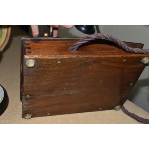 582 - AN EARLY 20TH CENTURY 'THE MAGNET' TELEPHONE, on a wooden base, height 20cm (Condition Report: in wo... 