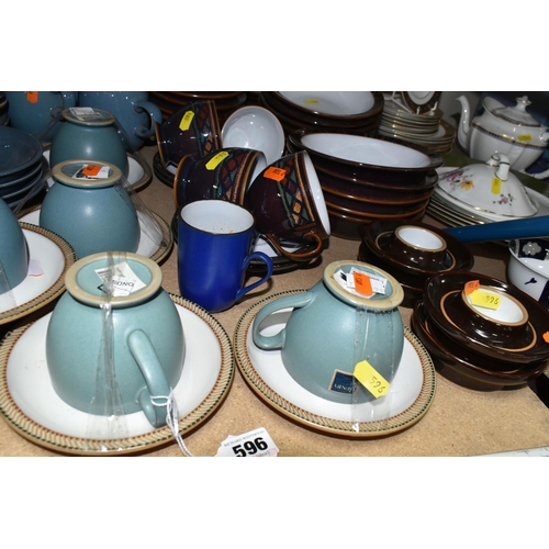 596 - A LARGE COLLECTION OF DENBY TABLEWARE, comprising five 'Luxor' design cups and five saucers, four di... 