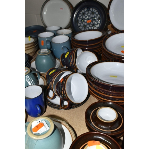 596 - A LARGE COLLECTION OF DENBY TABLEWARE, comprising five 'Luxor' design cups and five saucers, four di... 