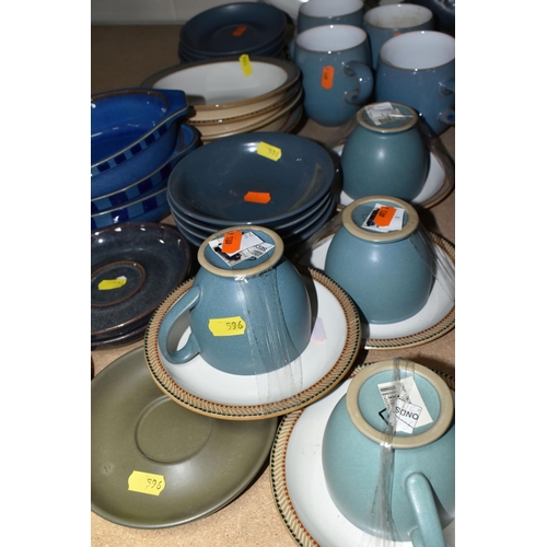 596 - A LARGE COLLECTION OF DENBY TABLEWARE, comprising five 'Luxor' design cups and five saucers, four di... 