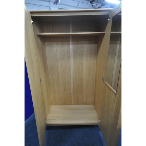 1200 - AN ERCOL SAVONA OAK TWO DOOR WARDROBE, enclosing an internal mirror to the right door, and a shelf, ... 