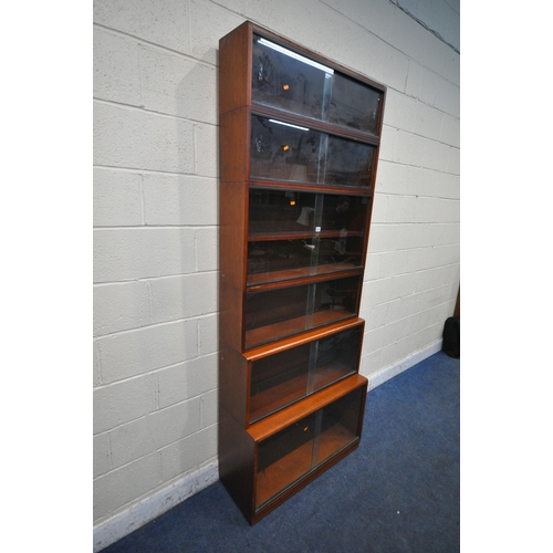 1201 - A 20TH CENTURY SIMPLEX SIX SECTION MAHOGANY STACKING BOOKCASE, all sections with double sliding glas... 