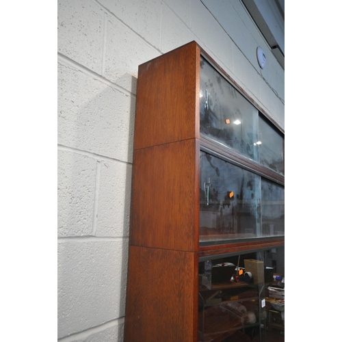 1201 - A 20TH CENTURY SIMPLEX SIX SECTION MAHOGANY STACKING BOOKCASE, all sections with double sliding glas... 