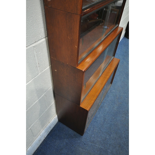 1201 - A 20TH CENTURY SIMPLEX SIX SECTION MAHOGANY STACKING BOOKCASE, all sections with double sliding glas... 