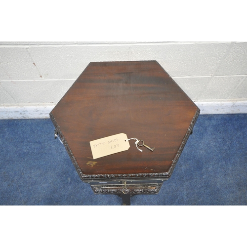 1202 - A GEORGIAN MAHOGANY HEXAGONAL CELLARETTE ON STAND, with brass banding, twin metal handles, the hinge... 