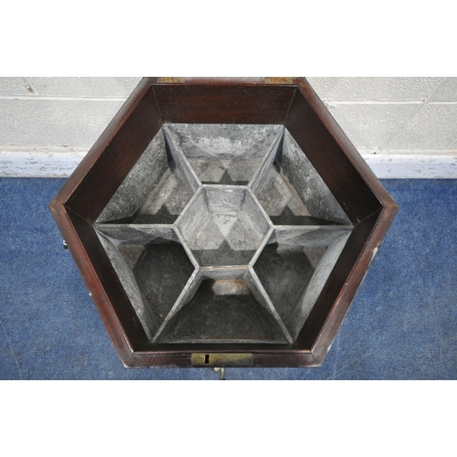 1202 - A GEORGIAN MAHOGANY HEXAGONAL CELLARETTE ON STAND, with brass banding, twin metal handles, the hinge... 