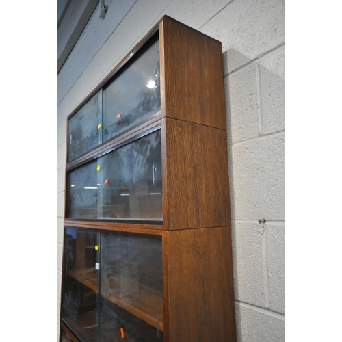 1219 - A 20TH CENTURY SIMPLEX SIX SECTION MAHOGANY STACKING BOOKCASE, all sections with double sliding glas... 