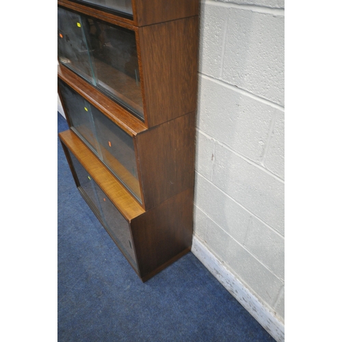 1219 - A 20TH CENTURY SIMPLEX SIX SECTION MAHOGANY STACKING BOOKCASE, all sections with double sliding glas... 