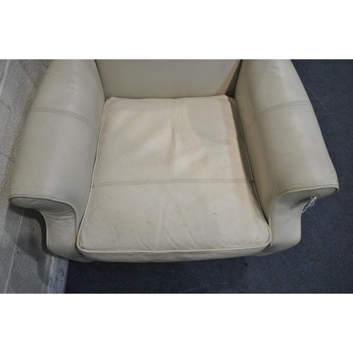 1229 - A CREAM LEATHER UPHOLSTERED WING BACK ARMCHAIR, width 82cm x depth 85cm x height 102cm (condition re... 