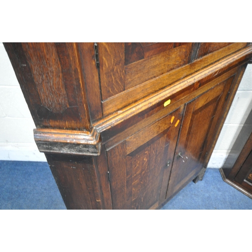 1237 - A LARGE GEORGIAN OAK CORNER CUPBOARD, with four cupboard doors, width 100cm x depth 62cm x height 21... 