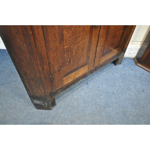 1237 - A LARGE GEORGIAN OAK CORNER CUPBOARD, with four cupboard doors, width 100cm x depth 62cm x height 21... 