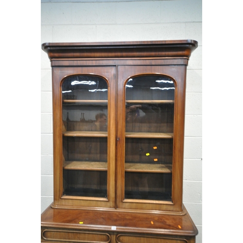 1238 - A 19TH CENTURY MAHOGANY BOOKCASE, the top with double glazed doors, that's enclosing three shelves, ... 