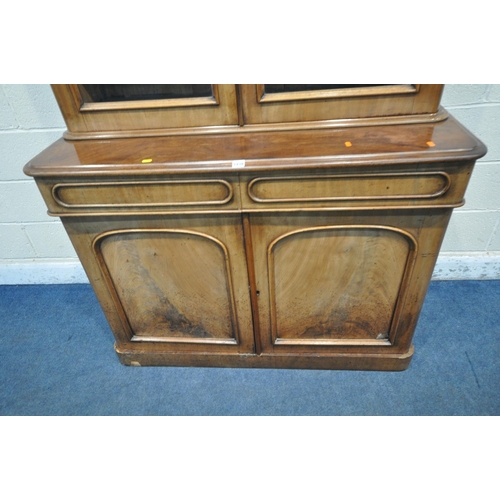 1238 - A 19TH CENTURY MAHOGANY BOOKCASE, the top with double glazed doors, that's enclosing three shelves, ... 