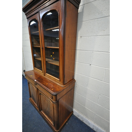 1238 - A 19TH CENTURY MAHOGANY BOOKCASE, the top with double glazed doors, that's enclosing three shelves, ... 