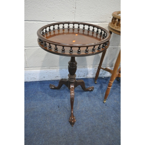 1249 - A REPRODUCTION MAHOGANY CIRCULAR TRIPOD TABLE, with raised gallery, turned support and ball and claw... 