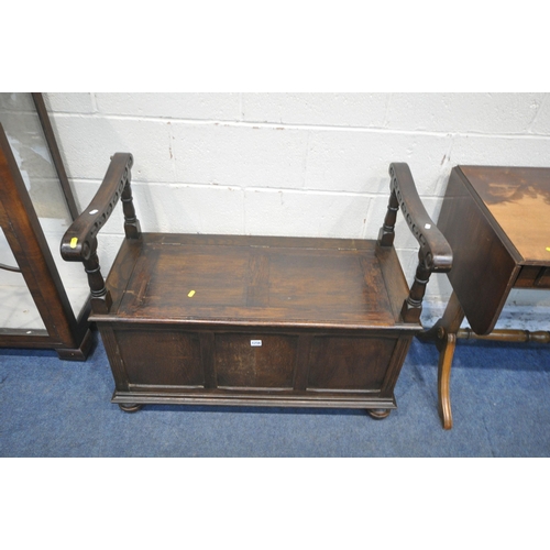 1256 - A 20TH CENTURY OAK MONKS BENCH, with a hinged storage compartment, a mahogany drop leaf sofa table a... 