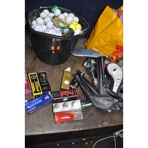 1060 - A COLLECTION OF GOLF BALLS AND ACCESSORIES including a large quantity of used golf balls, twelve tri... 