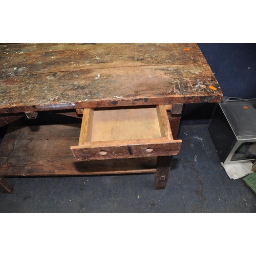 1073 - A VINTAGE WOODEN WORKSHOP BENCH with a single drawer and vice fitted width 137cm depth 60cm height 8... 