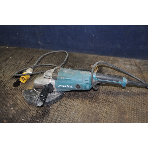 1080 - A MAKITA A9020 110V 9in ANGLE GRINDER with key (working but slow to start, spindle lock stiff)