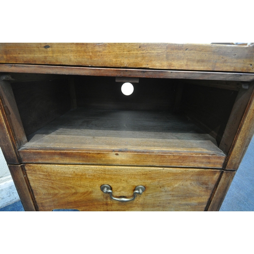 1263 - A GEORGIAN MAHOGANY BEDSIDE TRAY TOP COMMODE, with twin handles, a hide and fall door, above a pull ... 