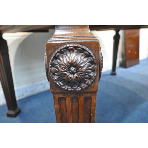 1264 - AN EARLY 20TH CENTURY MAHOGANY OVAL WIND OUT DINING TABLE, with two additional leaves, on square tap... 