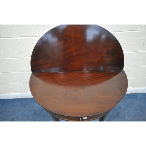 1269 - A GEORGIAN MAHOGANY DEMI-LUNE FOLD OVER TEA TABLE, with a single frieze drawer, raised on square tap... 