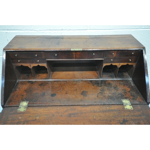 1271 - A GEORGIAN MAHOGANY BUREAU, the fall front door enclosing a fitted interior, above four drawers, on ... 