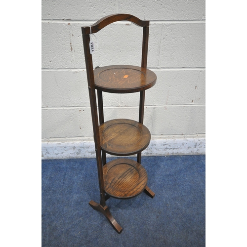 1281 - A 20TH CENTURY OAK THREE TIER FOLDING CAKE STAND, height 90cm (condition report: historical wear and... 