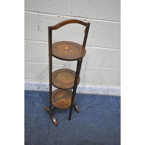 1281 - A 20TH CENTURY OAK THREE TIER FOLDING CAKE STAND, height 90cm (condition report: historical wear and... 