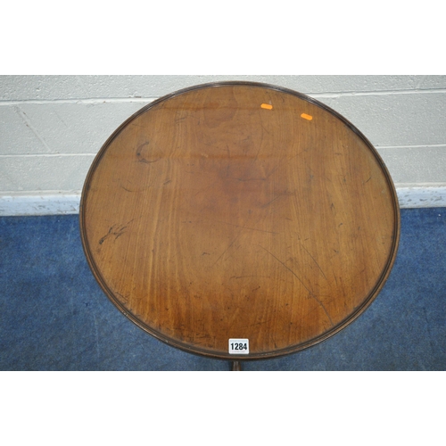 1284 - A GEORGIAN MAHOGANY DISH TOP TRIPOD TABLE, with a birdcage style mechanism, raised on a turned suppo... 